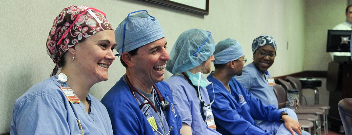 Brown anesthesiologists dressed in hospital scrubs