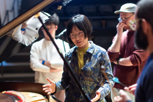 Lu Wang teaches at a piano