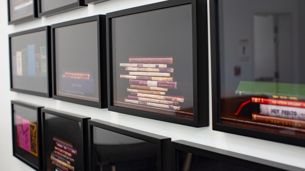 closeup of photographs showing stacked books